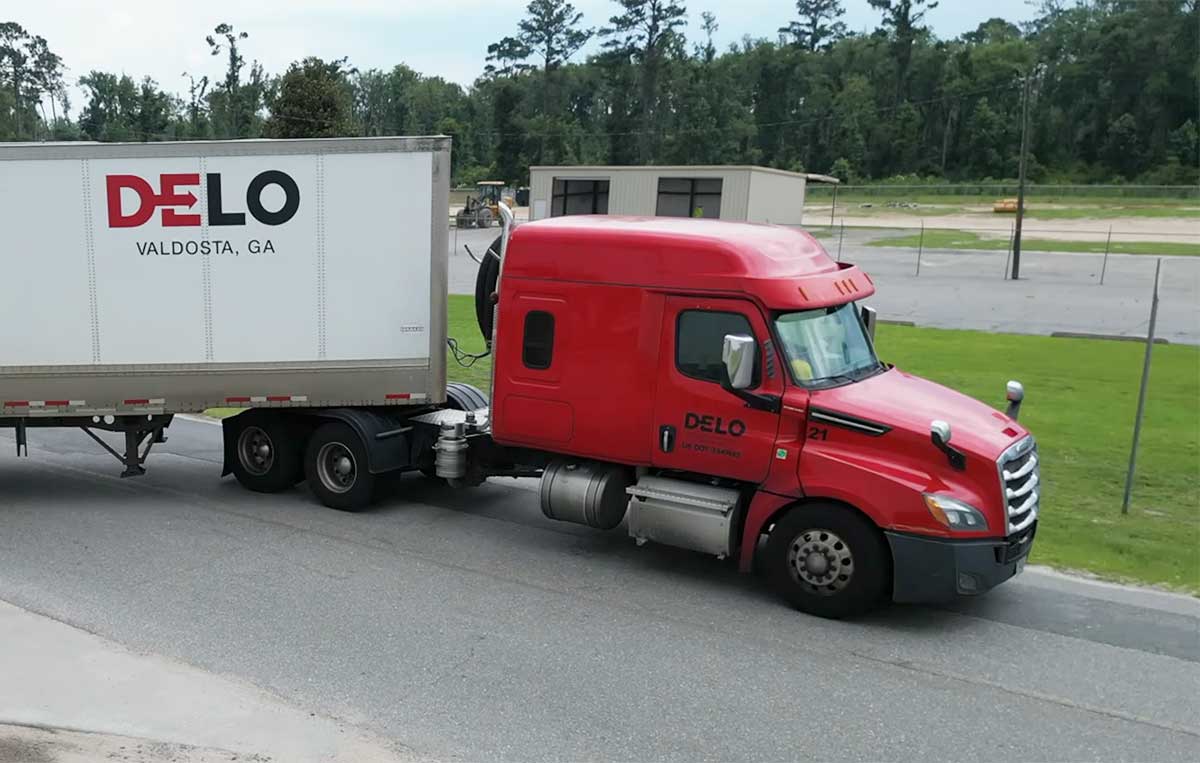 A Desirable Logistics Company Semi pulling out of docking bay at the warehouse