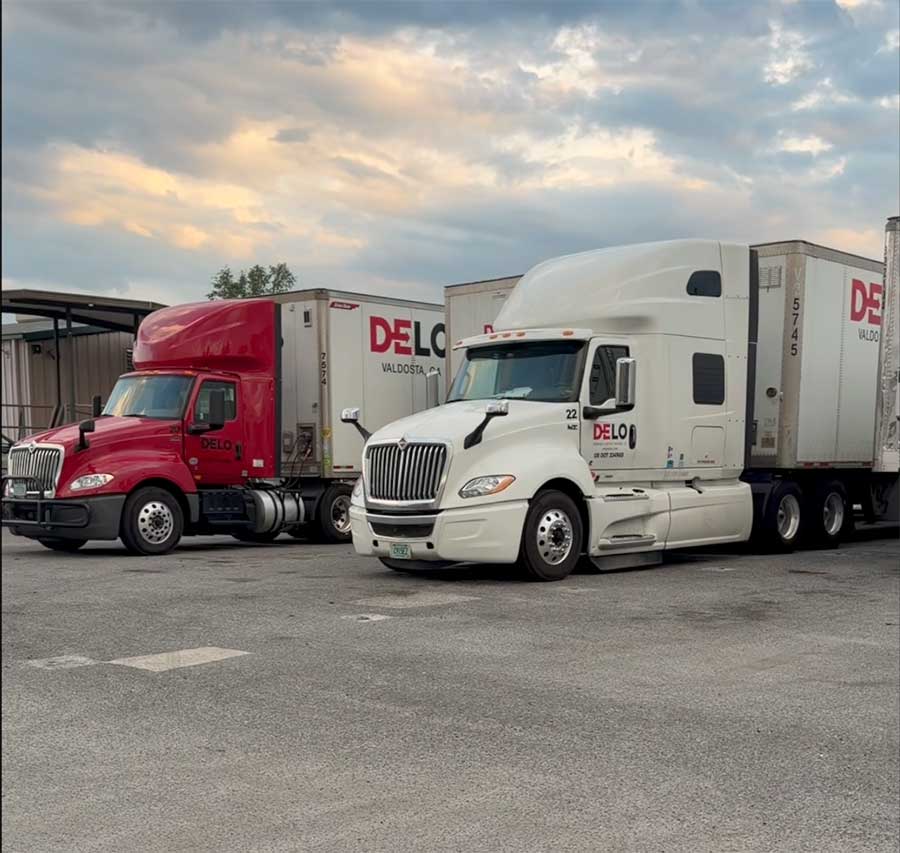 Desirable Logistics trucks waiting on standby to deliver loads cross country